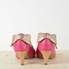 Open-toed pump in raspberry and champagne paillette